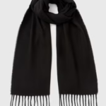 Keep it classic with this Black Fringe Trim Scarf. Crafted from a soft, cozy fabric and finished with delicate fringe edging, it’s a timeless accessory that adds both warmth and style. The versatile black shade makes it easy to pair with any outfit, whether casual or smart, while the elegant design ensures it remains a staple in your wardrobe season after season.

Fringe Trim
Scarf
Black