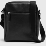 Our Black Cross Body Bag is a timeless accessory crafted for everyday sophistication. Made from faux leather, this compact yet functional bag features an adjustable strap for comfortable wear and a sleek design that pairs effortlessly with any outfit.

Classic black colour
Non leather construction
Adjustable cross body strap
Compact and versatile for daily use