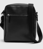 Our Black Cross Body Bag is a timeless accessory crafted for everyday sophistication. Made from faux leather, this compact yet functional bag features an adjustable strap for comfortable wear and a sleek design that pairs effortlessly with any outfit.

Classic black colour
Non leather construction
Adjustable cross body strap
Compact and versatile for daily use